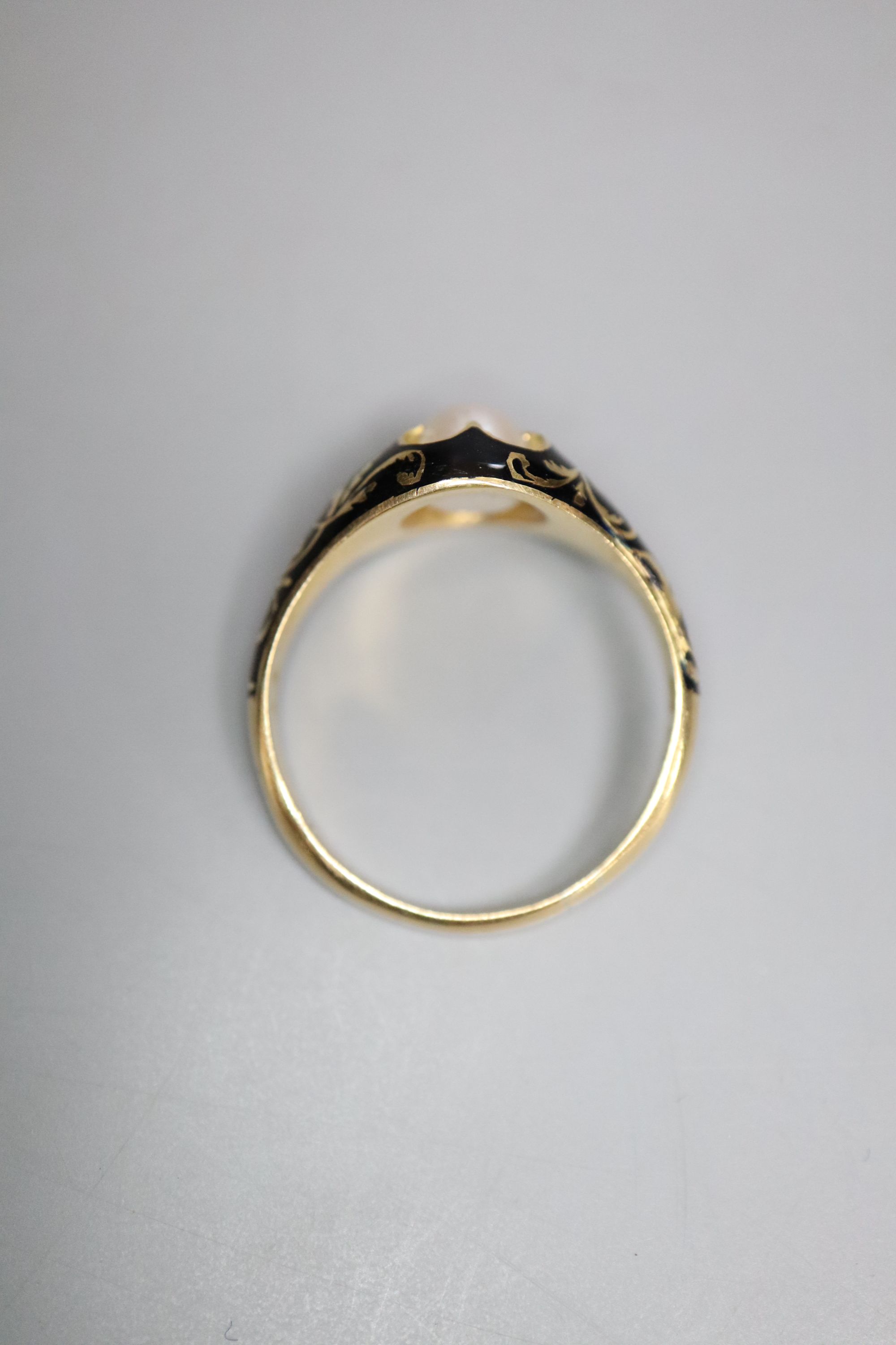 A Victorian 18ct gold, black enamel and pearl memorial ring, gross 3.7 grams, size Q.